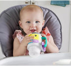 Fisher-Price infant tumbler toy showing the mocha rattle beads on the flipped lid.