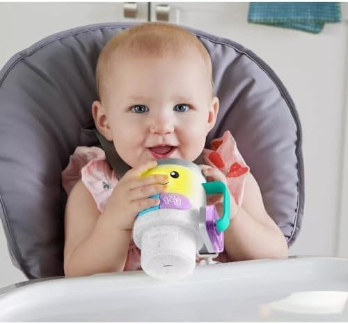 Fisher-Price infant tumbler toy showing the mocha rattle beads on the flipped lid.