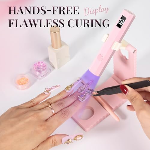 Cordless mini ultraviolet nail dryer curing gel polish on a thumbnail