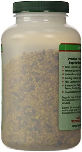 Raw golden fresh bee pollen granules close up view showing natural texture