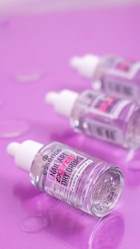 Hand applying essence nail drops to freshly painted nails