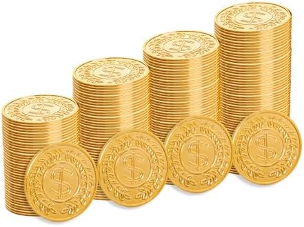 Plastic gold coins filling up a small black decorative Halloween cauldron