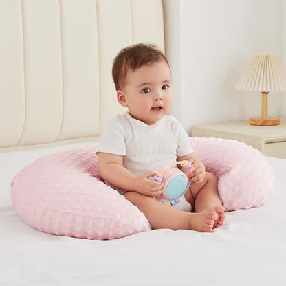 Ergonomic nursing pillow showing plush fabric texture