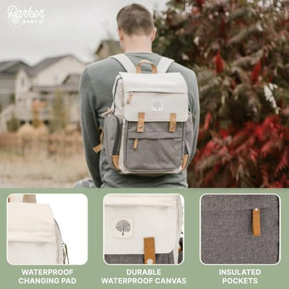 Parker Baby Co. luxury diaper bag attached to a stroller handlebar using the included stroller straps