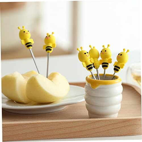 Close up of stainless steel fork with silicone bee handle detail