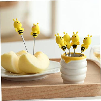 Close up of stainless steel fork with silicone bee handle detail