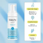 Herbal infused plant based feminine wash for sensitive skin showing foaming pump dispenser.