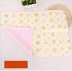 Baby lying on a clean waterproof changing mat