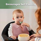 Haakaa first stage training spoons showcasing the soft silicone texture for teething babies.