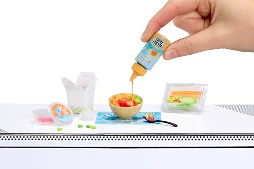 Miniature cafe food replica from Miniverse Series 6 being cured under UV light.