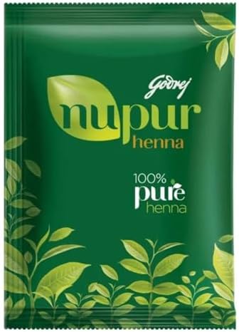 Pure Rajasthani henna powder paste preparation for herbal hair conditioning treatment.