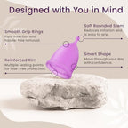 Soft flexible EcoBlossom period cup being held to demonstrate material quality.