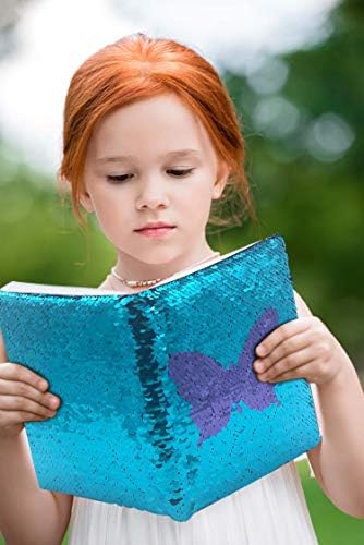 Open Ginmlyda sequin journal showing lined pages for writing.