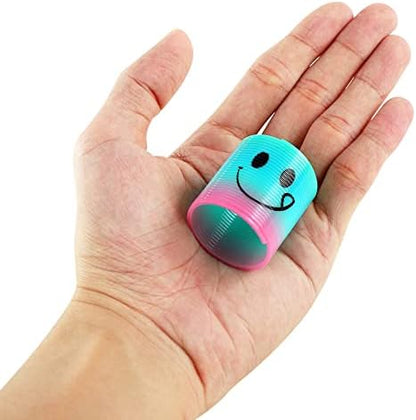 Fun-Here mini plastic coil toys stretched out to display flexible shape retention and bright rainbow gradient colors.
