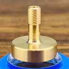 Authentic DjuiinoStar brass spinning top packaging and product display