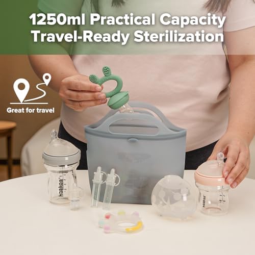 Parent using Haakaa silicone steamer bag for baby bottles in kitchen