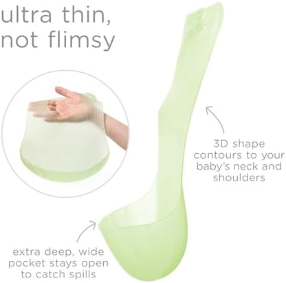 Olababy non toxic waterproof toddler bib being rinsed clean under running tap water.