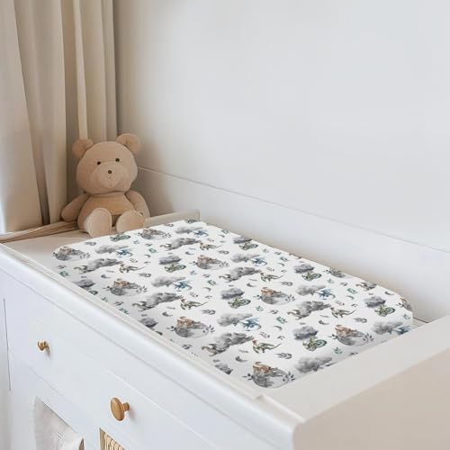 Whimsical moon and dragon motif closeup on soft polyester changing table sheet