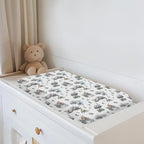 Whimsical moon and dragon motif closeup on soft polyester changing table sheet