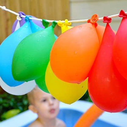 A deep storage container filled with water holding hundreds of prepared colorful water bombs