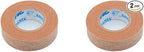 Close up view of 3M beige hypoallergenic paper tape rolls showing the breathable non-woven texture.