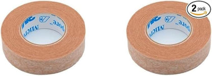 Close up view of 3M beige hypoallergenic paper tape rolls showing the breathable non-woven texture.