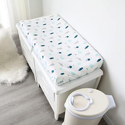 Underneath view of the changing table cover highlighting the premium all around elastic band for a snug fit.