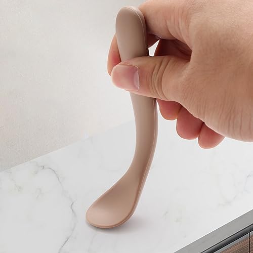 Eascrozn soft tip baby feeding spoons being loaded into a home dishwasher rack.
