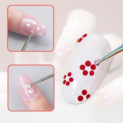 Hand holding a rainbow colored nail dotting pen creating an intricate floral pattern design