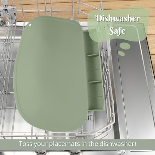 Flexible silicone material of a sage green baby dining mat being wiped clean easily.