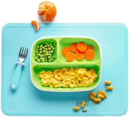 Munchkin kids dining mats rolled up compactly demonstrating easy travel portability for parents.