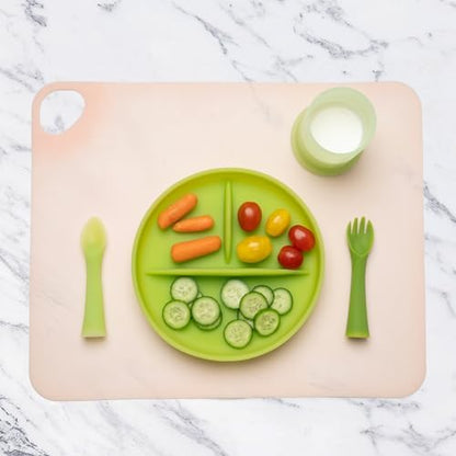Compact blueberry silicone dining mat for infants next to its portable storage container