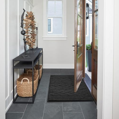Washable mud mat for dogs being placed inside a home washing machine.