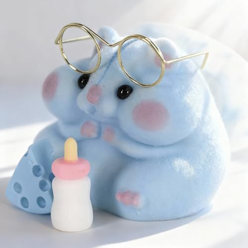 Handmade Taba hamster squishy toy next to its miniature feeding bottle accessory.