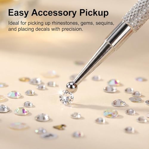 Set of five silver nail art dotting tools on a clean surface