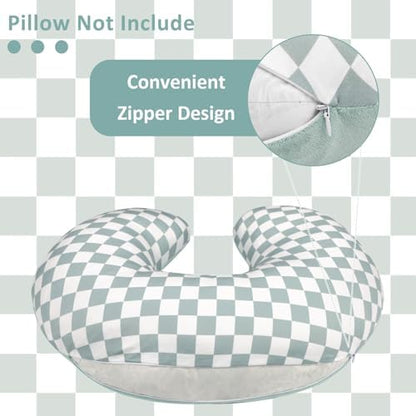 Reversible green checkered nursing pillow cover folded on a nursery chair
