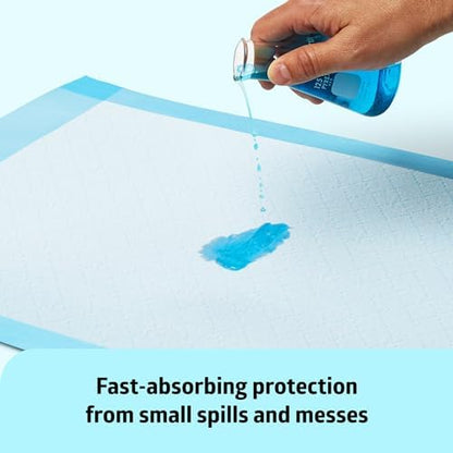 Medline absorbent sheet used as a clean puppy training pad on a tiled household floor surface.