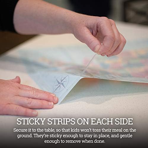 Toddler eating meal safely over a clear sticky transparent table mat protecting the surface
