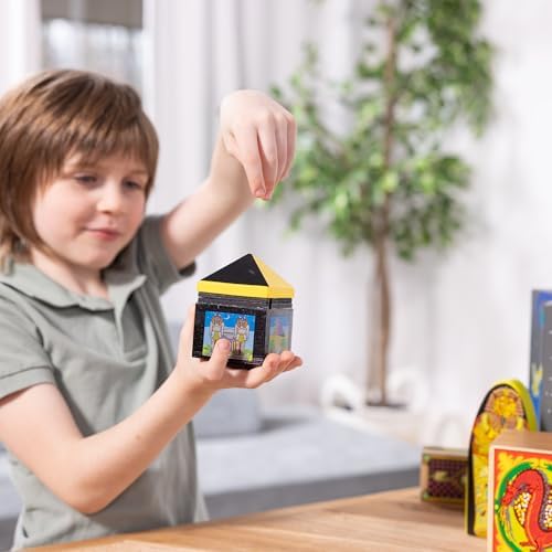Young child performing the disappearing ball illusion using components from the Melissa And Doug wooden magic kit
