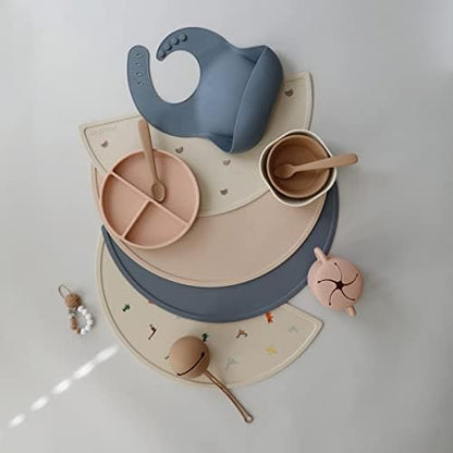 Rolled up view showing the flexible and travel friendly design of the baby placemat