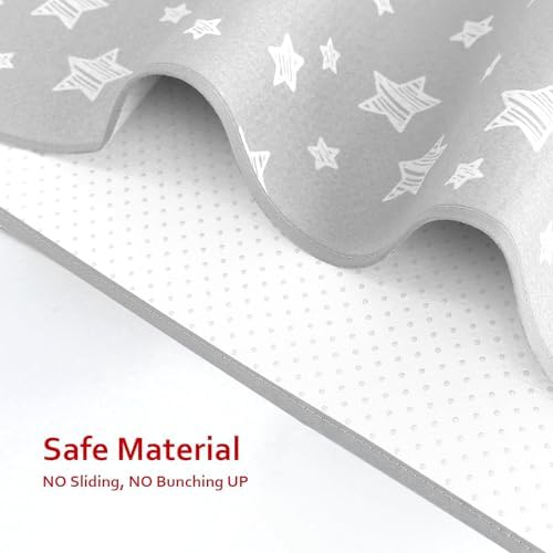 The textured non slip backing of the Moonsea baby mess mat preventing slips on hardwood tile.