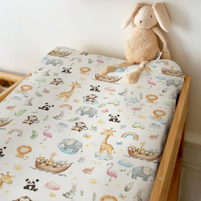 Side view showing elastic fit of animal print changing pad sheet