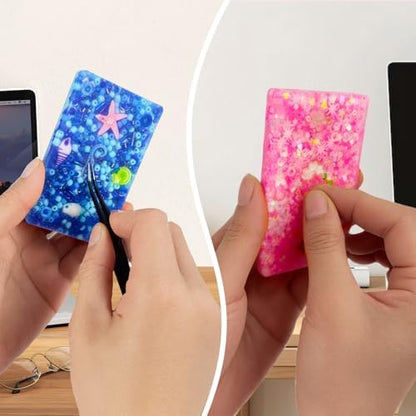 Adult using tweezers to extract beads from the pink food grade silicone picking pad for dermatillomania relief