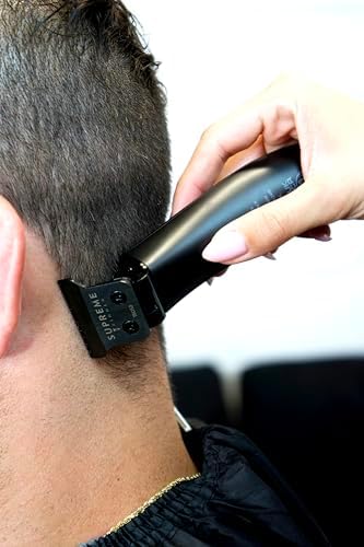 Lightweight professional detailing trimmer being held to show comfortable grip and compact size.