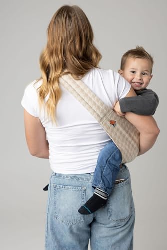 The breathable fabric texture of the Mabē Monarch houndstooth sling.