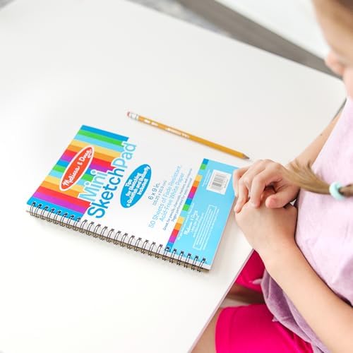 Authentic Melissa and Doug kids drawing pad showing spiral binding and portable size