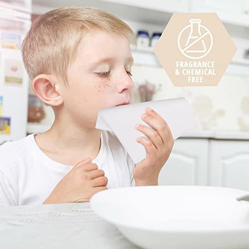Unscented disposable hospital wash cloths being moistened with water for skincare.