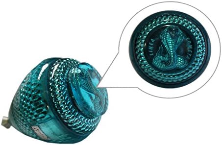 Assorted colors of Mini Cobra spinning tops in a group