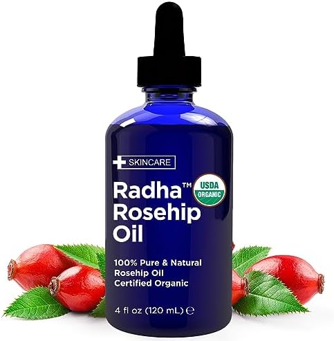 Radha Beauty Organic Rosehip Seed Oil front view of blue bottle with dropper.