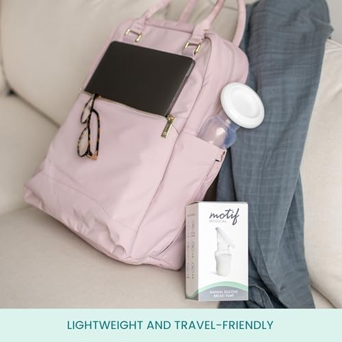 Motif Medical four ounce silicone breast pump compact design next to diaper bag